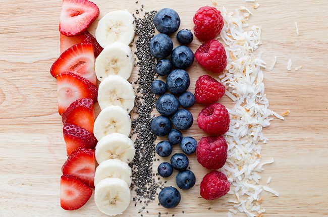 Overhead picture of smoothie bowl ingredients on a cutting board