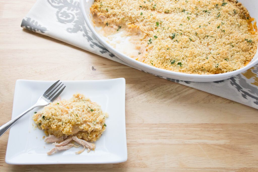 Overhead picture of keto chicken cordon bleu in casserole dish and on white saucer