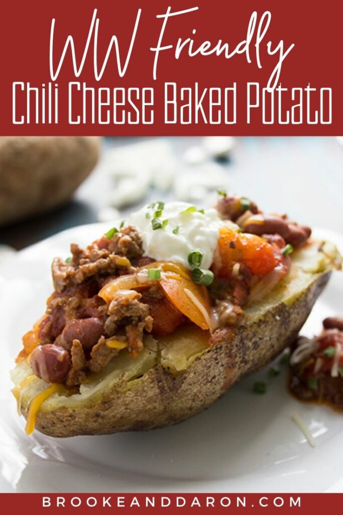 Half a baked potato topped with homemade chili on a white plate