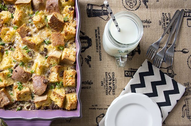 Overhead picture of a purple baking dish filled with make ahead breakfast casserole