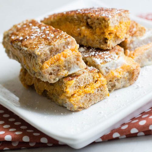 pumpkin french toast on a white plate with a napkin