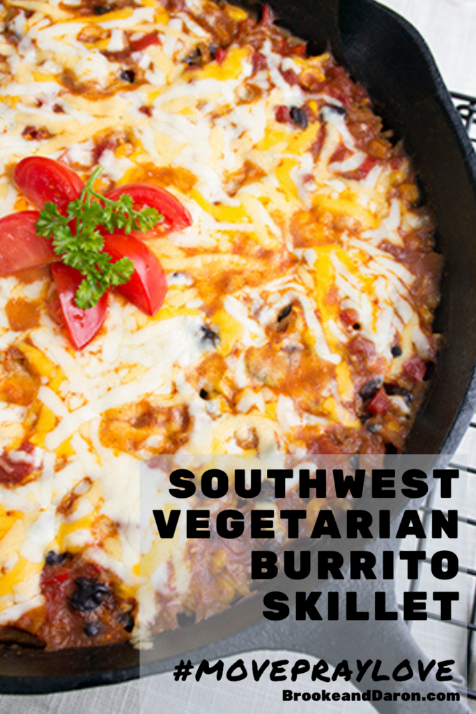 Burrito bowl topped with tomato