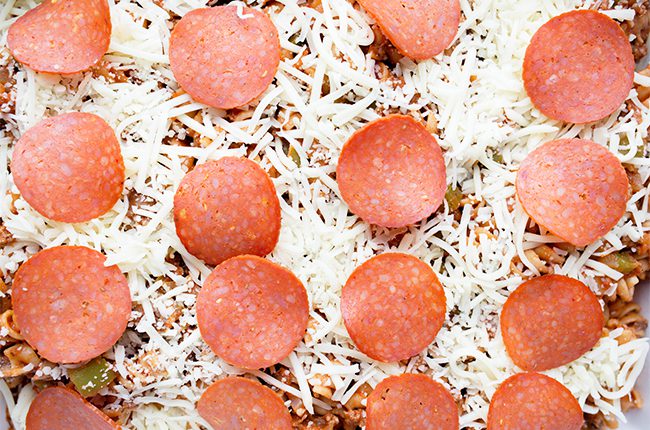 Supreme Pizza Pasta Casserole layering ingredients