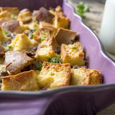 Up close picture of a purple casserole dish filled with make ahead breakfast casserole
