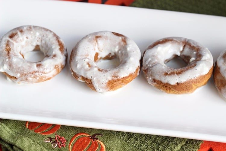 pumpkin donuts on a white plate