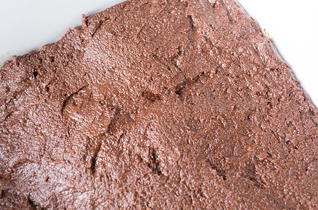 Brownie batter in a white baking dish