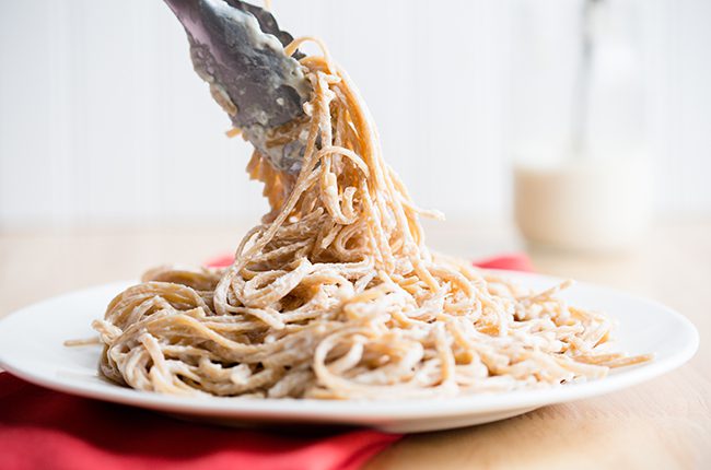 Light Alfredo Sauce whole wheat noodles coated in light alfredo sauce