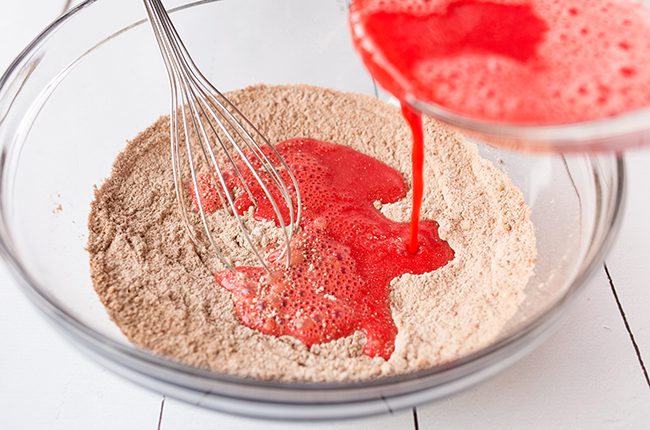 Adding red color to red velvet donuts batter
