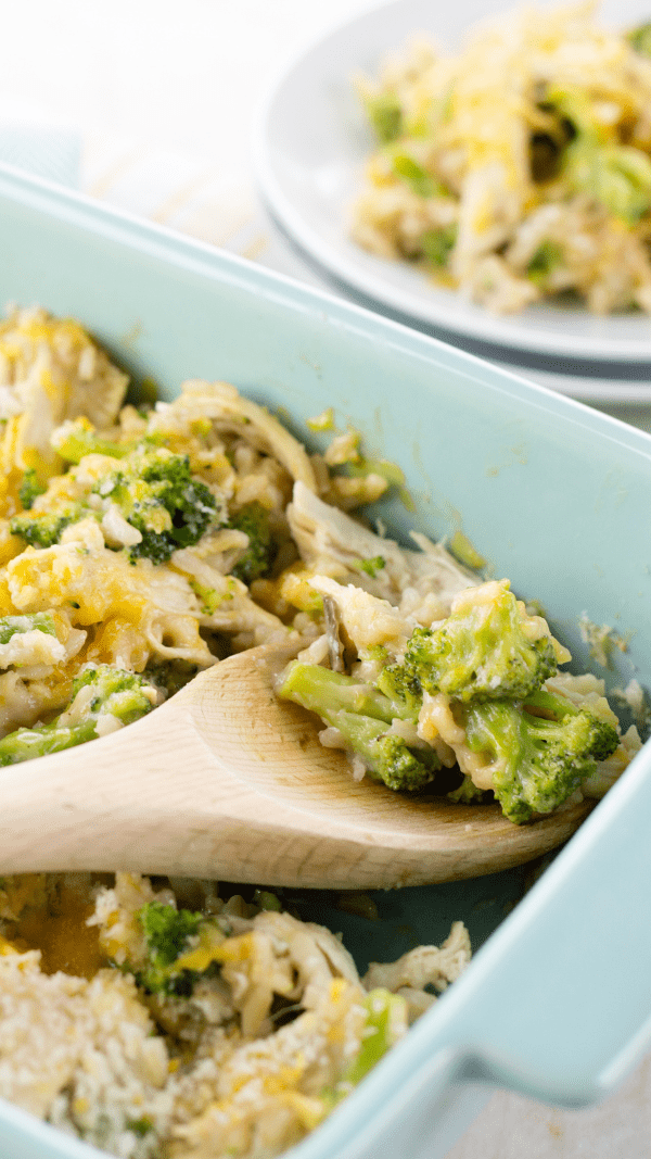 the best chicken and rice recipe cooked in casserole dish and spoon for serving