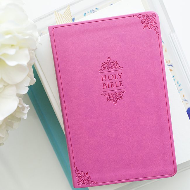 pink bible on table prayer and fasting