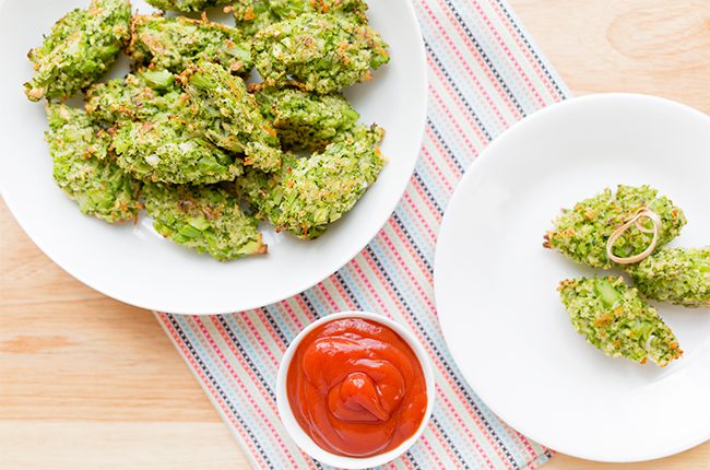 overhead shot of baked broccoli tots with ketchup