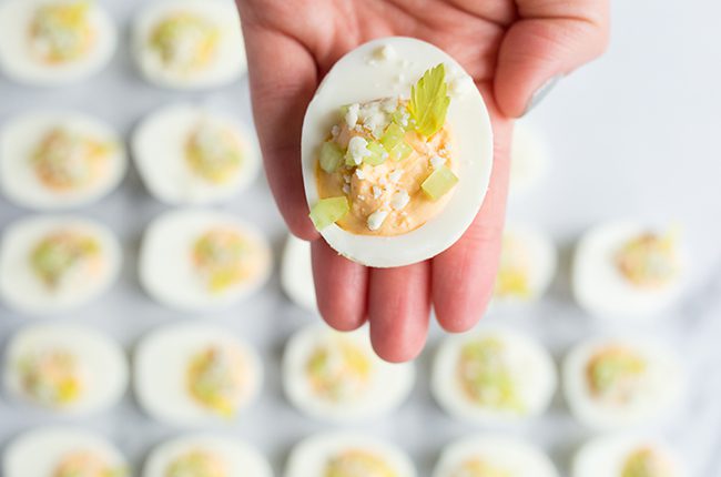 buffalo deviled egg in a hand