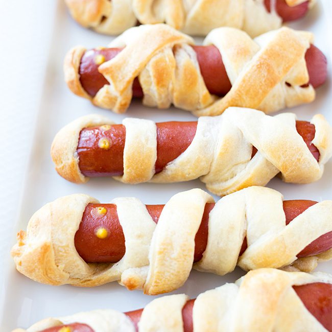 Mummy hot dogs up close fresh out of oven