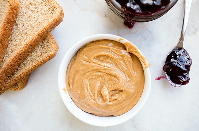 Overhead picture of peanut butter and jelly roll ingredients