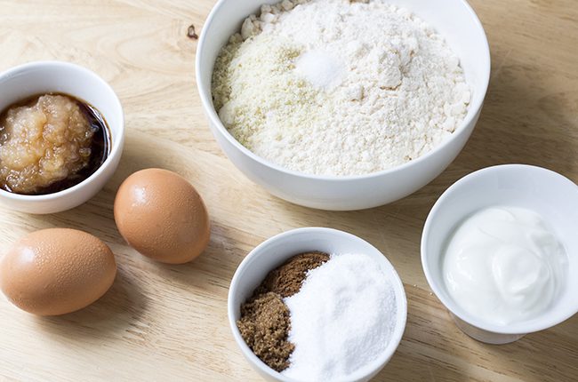 Ingredients for cinnamon coffee cake on a wooden surface