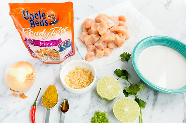 Ingredients for thai curry with chicken on a marble counter