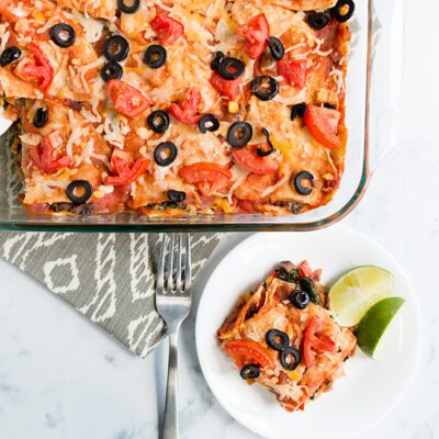 Overhead picture of mexican lasagna on a plate and in baking dish