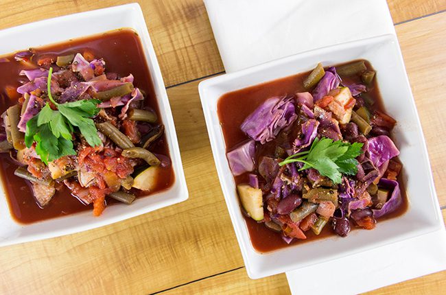 Two bowls of simple cabbage soup photographed from above
