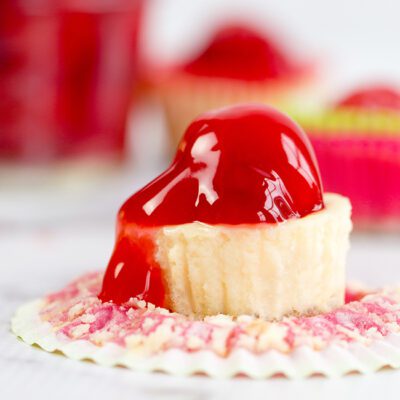 Up close picture of an unwrapped cherry mini cheesecake