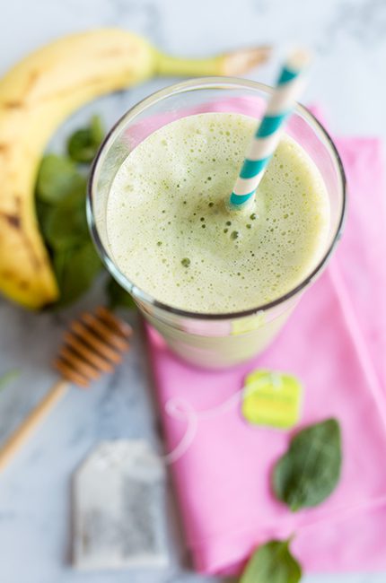 Overhead of green tea smoothie on napkin