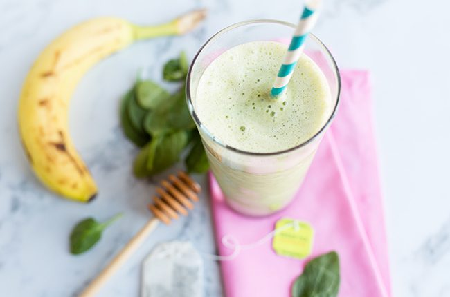 Glass filled with smoothie on pink napkin