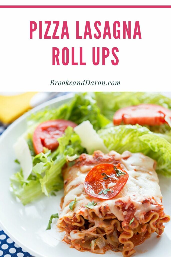 Lasagna on white plate with salad