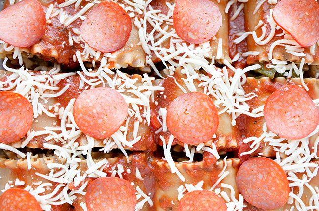 Pepperoni topped lasagna rolls uncooked