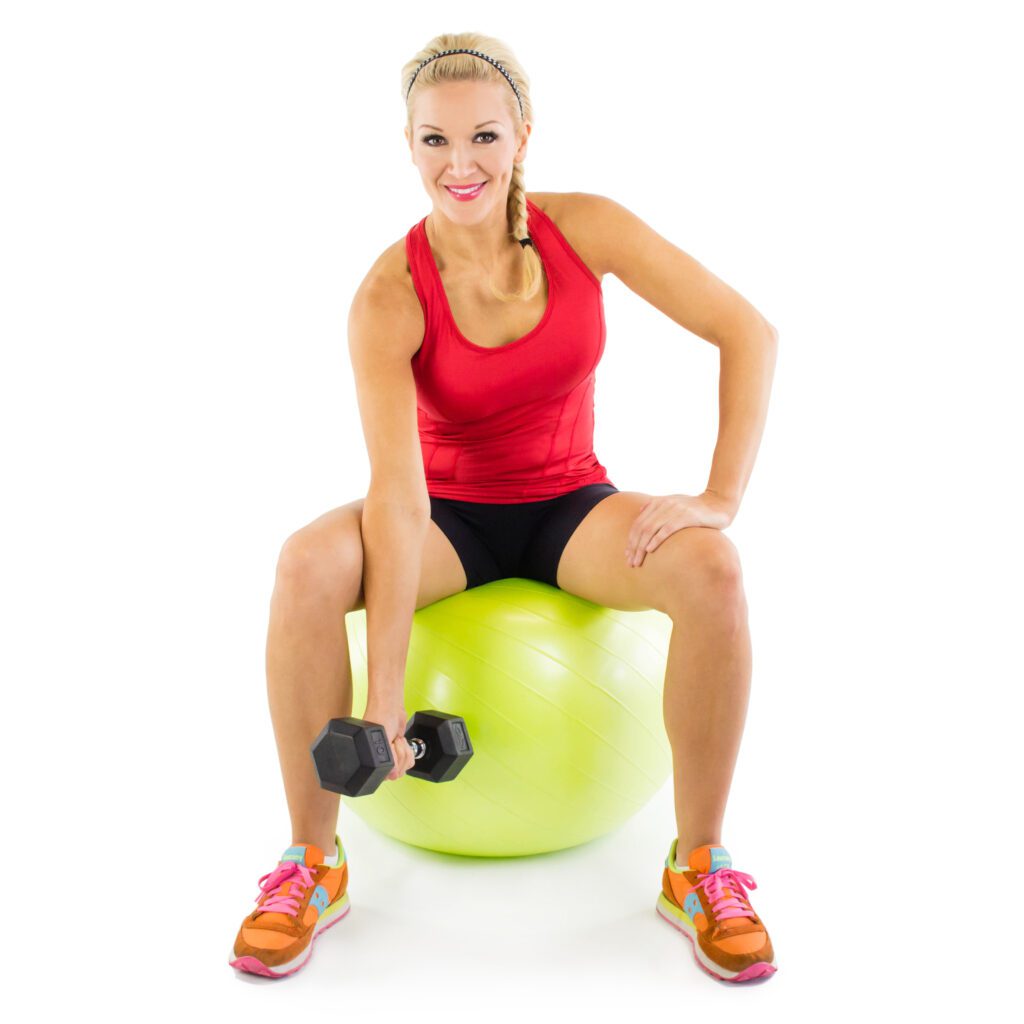 image of girl doing concentration curl on stability ball with dumbbell