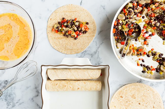 image of rolling enchiladas and placing seam side down