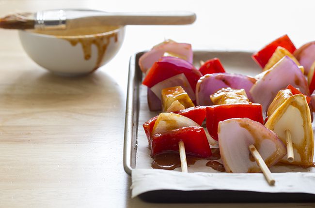 Brushing the sauce on Ready to Grill Barbecue Chicken Skewers