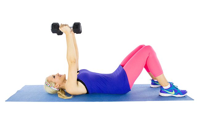 image of Brooke doing a skull crusher lying down