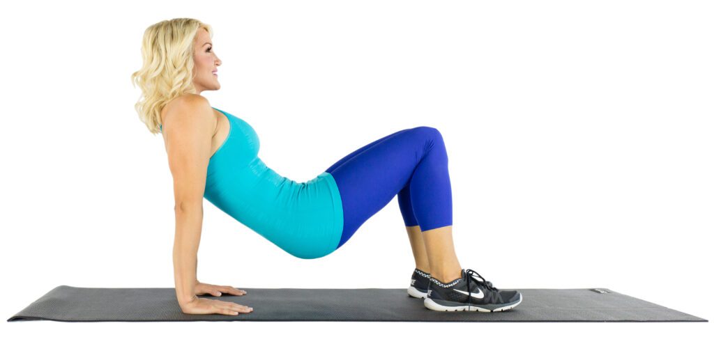 image of Brooke doing tricep dip on floor