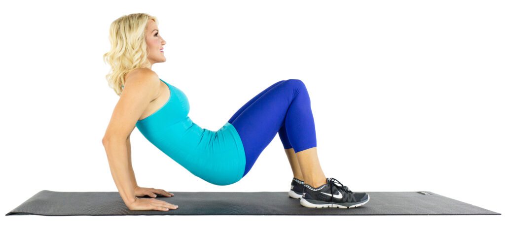 image of Brooke doing tricep extension on floor