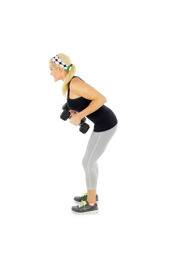 image of tricep kickback step one brooke farmer for dumbbell arm workout routine