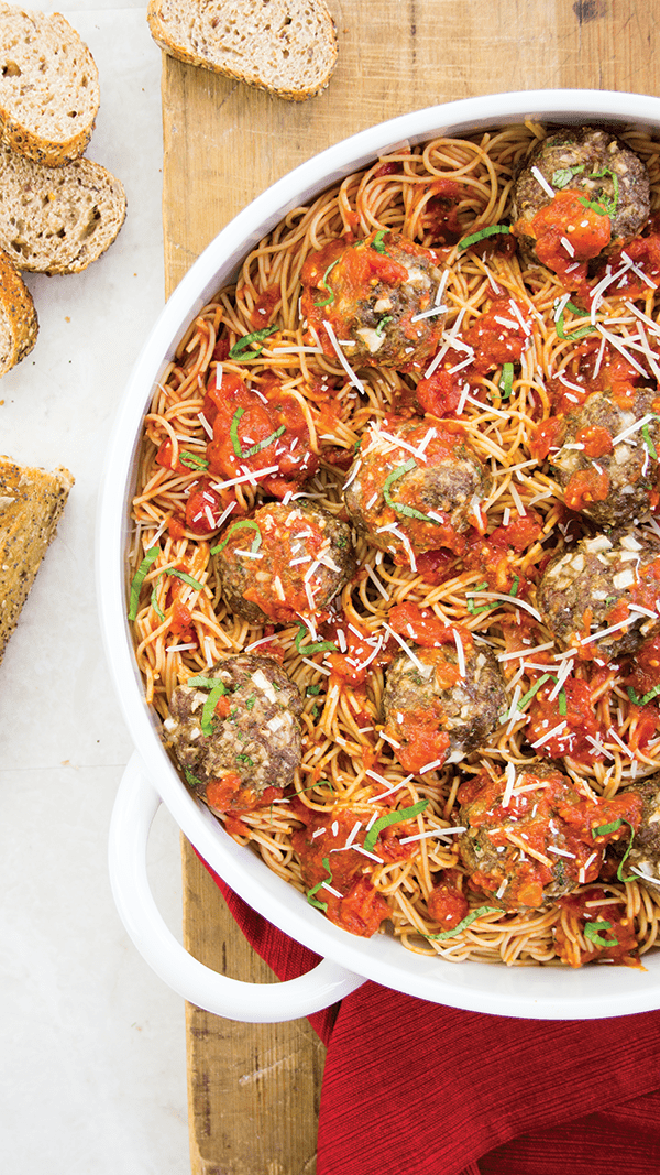 overhead vertical shot of spaghetti and meatballs in pan