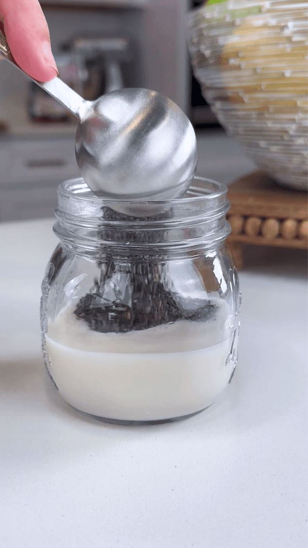 Chia Seeds being added to Almond Milk