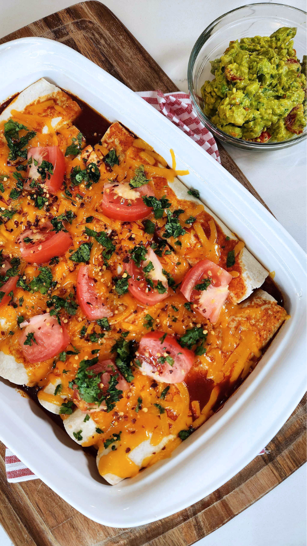 Perfect Chicken Enchiladas Recipe Plated with Guacamole