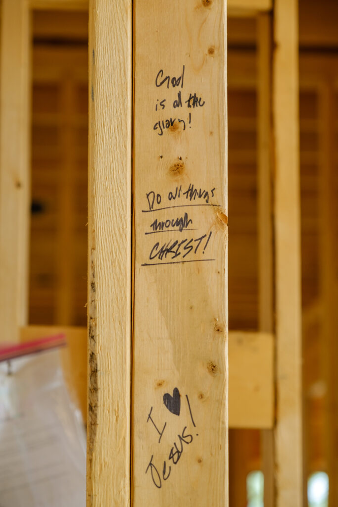 Writing scripture on custom home framing