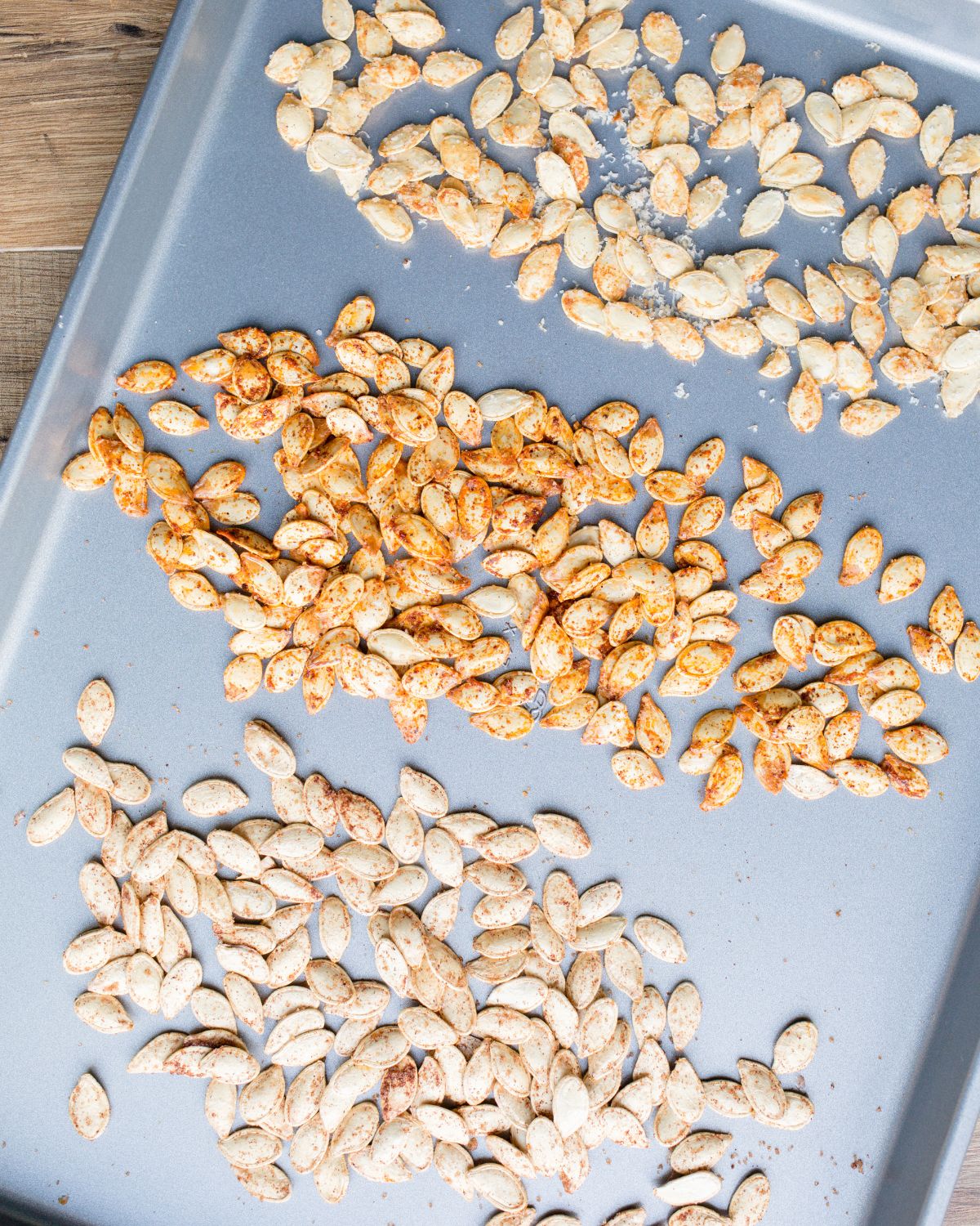 Seasoned Pumpkin Seeds on a Baking Sheet